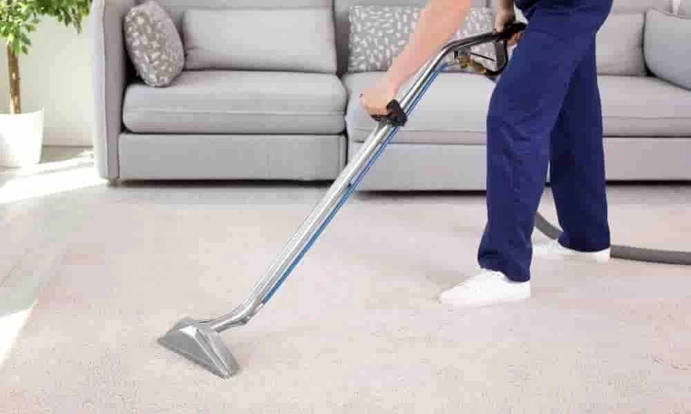 Professional carpet cleaning in a Bacchus Marsh home, showing a technician using a steam cleaner.